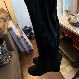 Tall black wedge boots